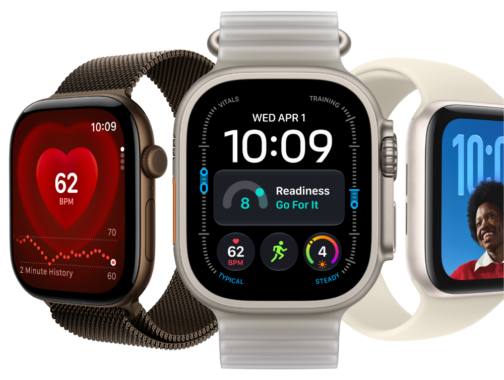 Tre Apple Watch-modeller side om side med forskellige urskiver, herunder hjerterytme, træningsdata og portræt.
